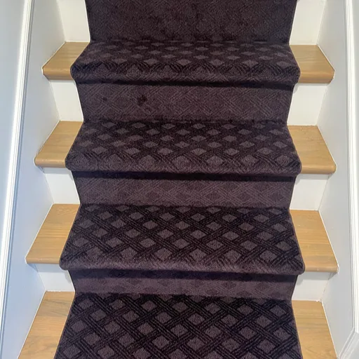Brown carpet stair runner at Main Floor Carpet One